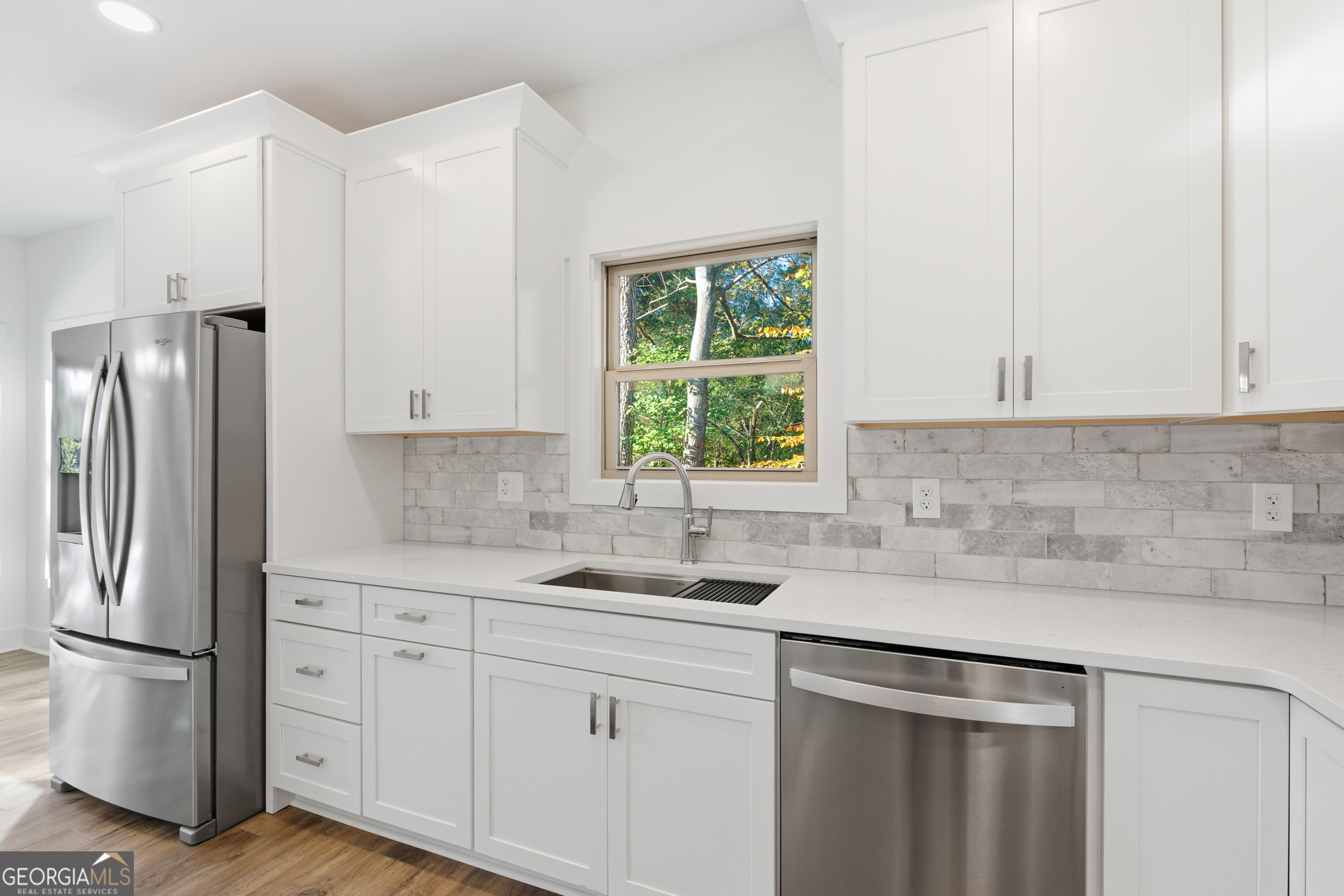 259 West Currahee Street Toccoa, GA 30577 - Photo 13 of 47 a kitchen with stainless steel appliances white cabinets and a sink