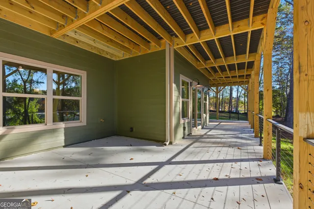 a kitchen with stainless steel appliances white cabinets granite counter tops and a stove