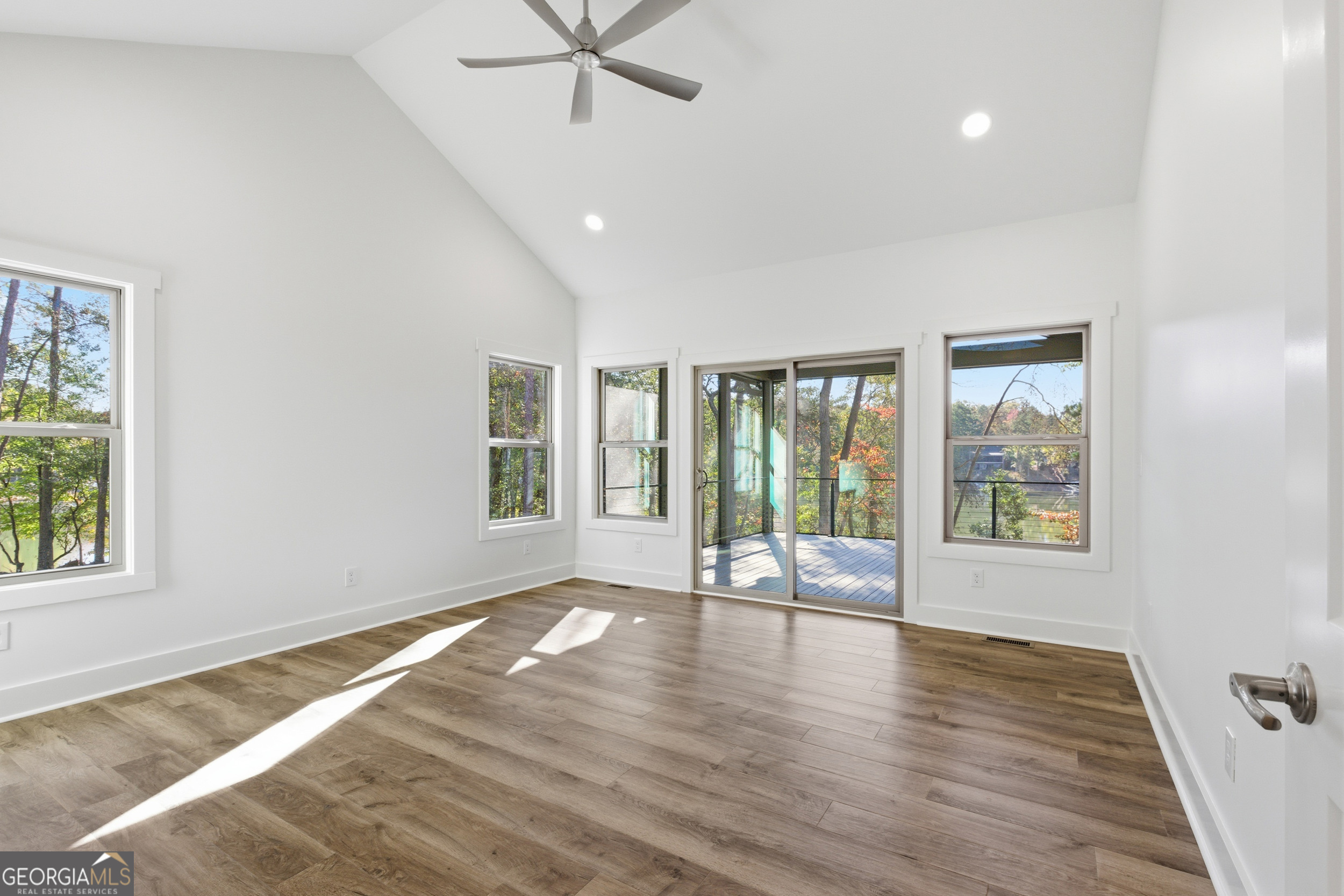 259 West Currahee Street Toccoa, GA 30577 - Photo 23 of 47 a view of an empty room with a window and wooden floor