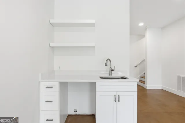 a bathroom with a sink toilet and a bathtub
