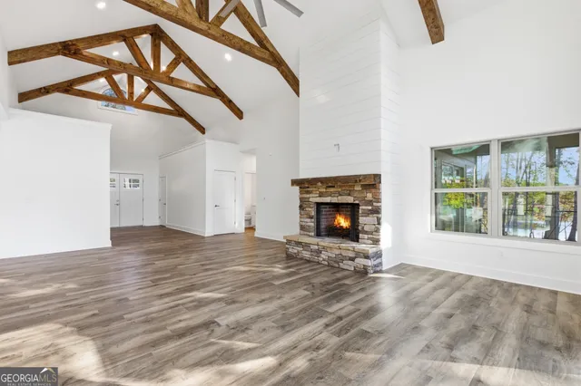 a kitchen with stainless steel appliances granite countertop a refrigerator a oven and a sink