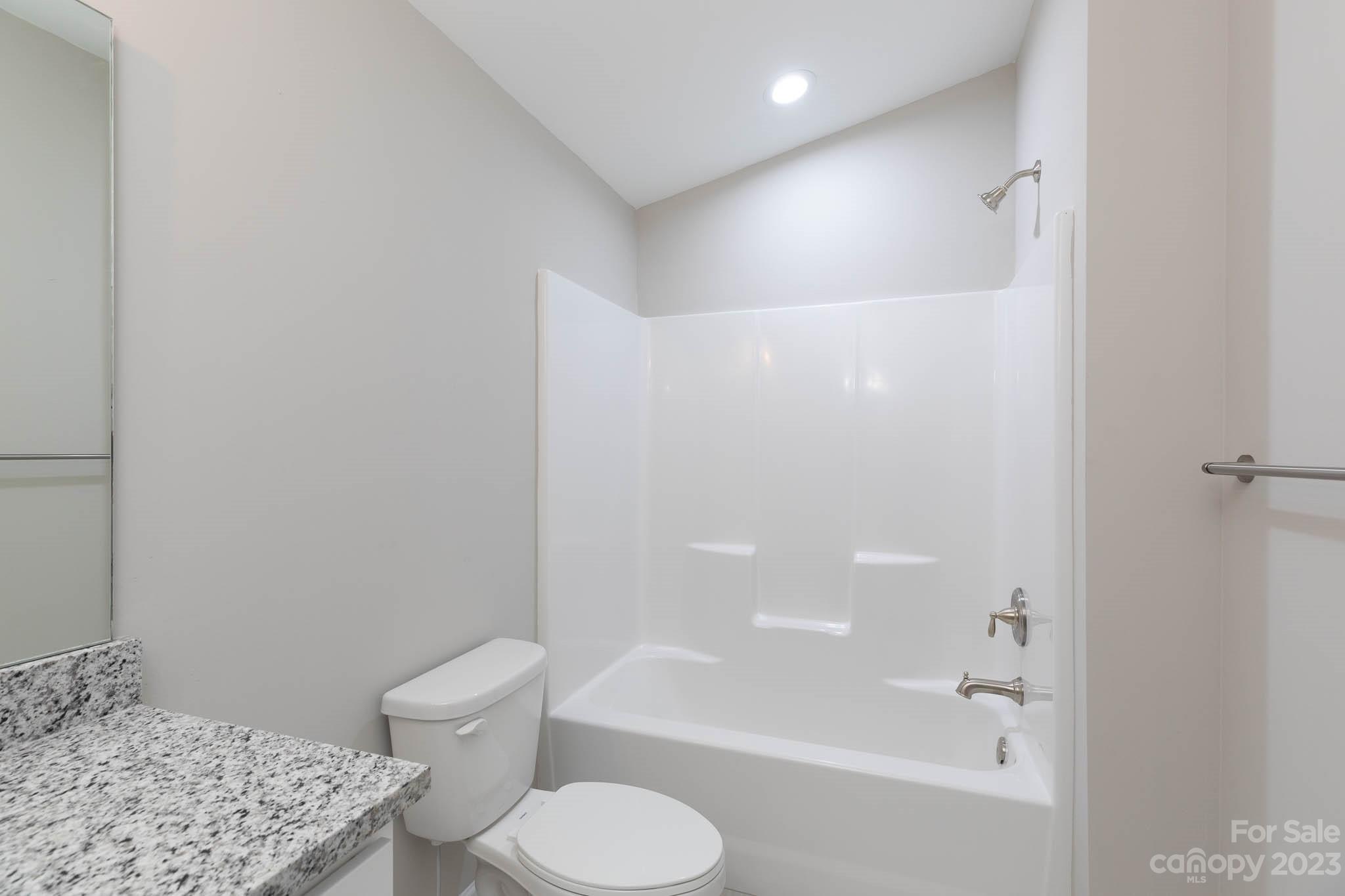 4639 Simpson Road Edgemoor, SC 29712 - Photo 22 of 30 a bathroom with a shower and a toilet