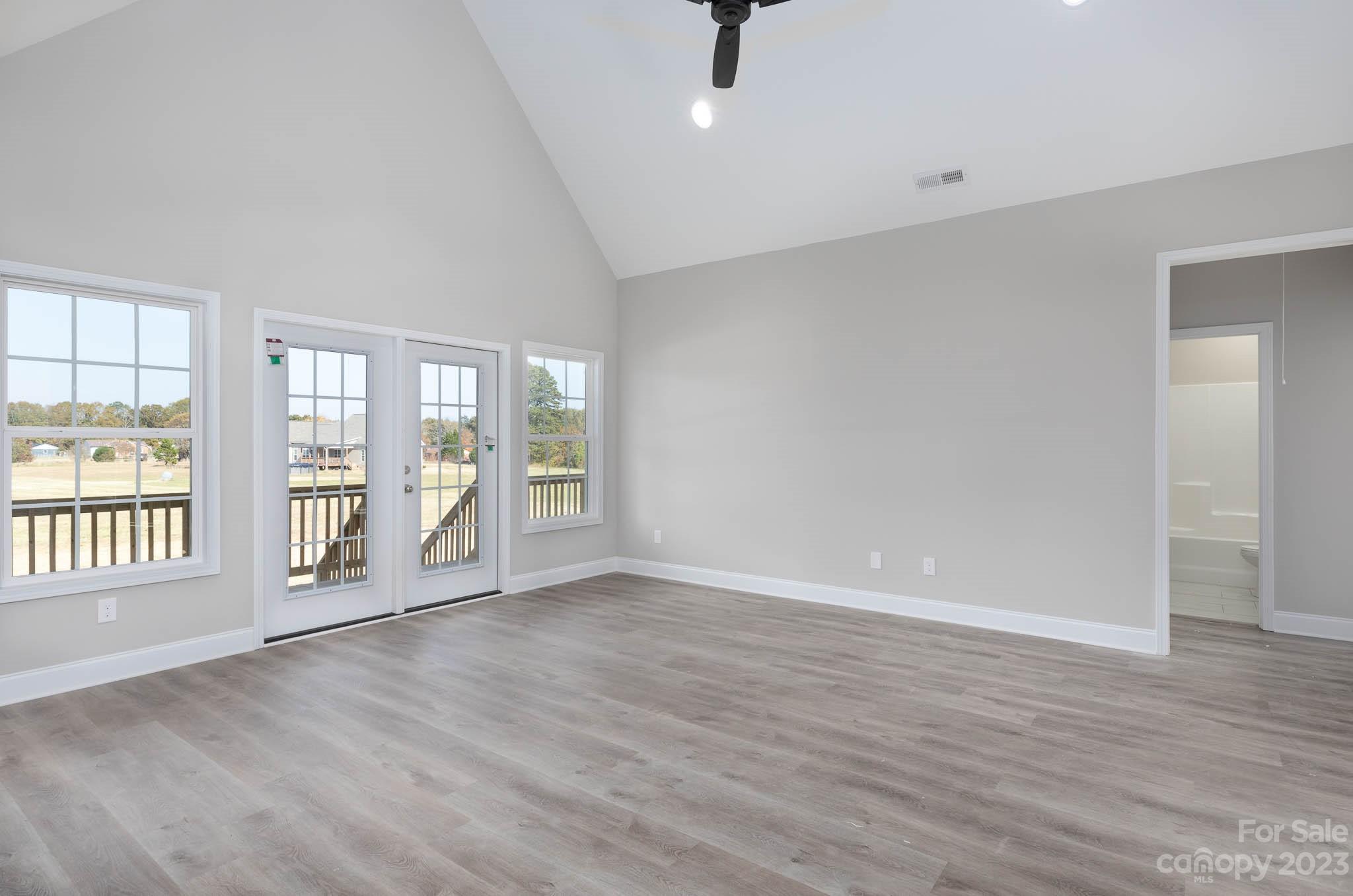 4639 Simpson Road Edgemoor, SC 29712 - Photo 4 of 30 wooden floor in an empty room with a window