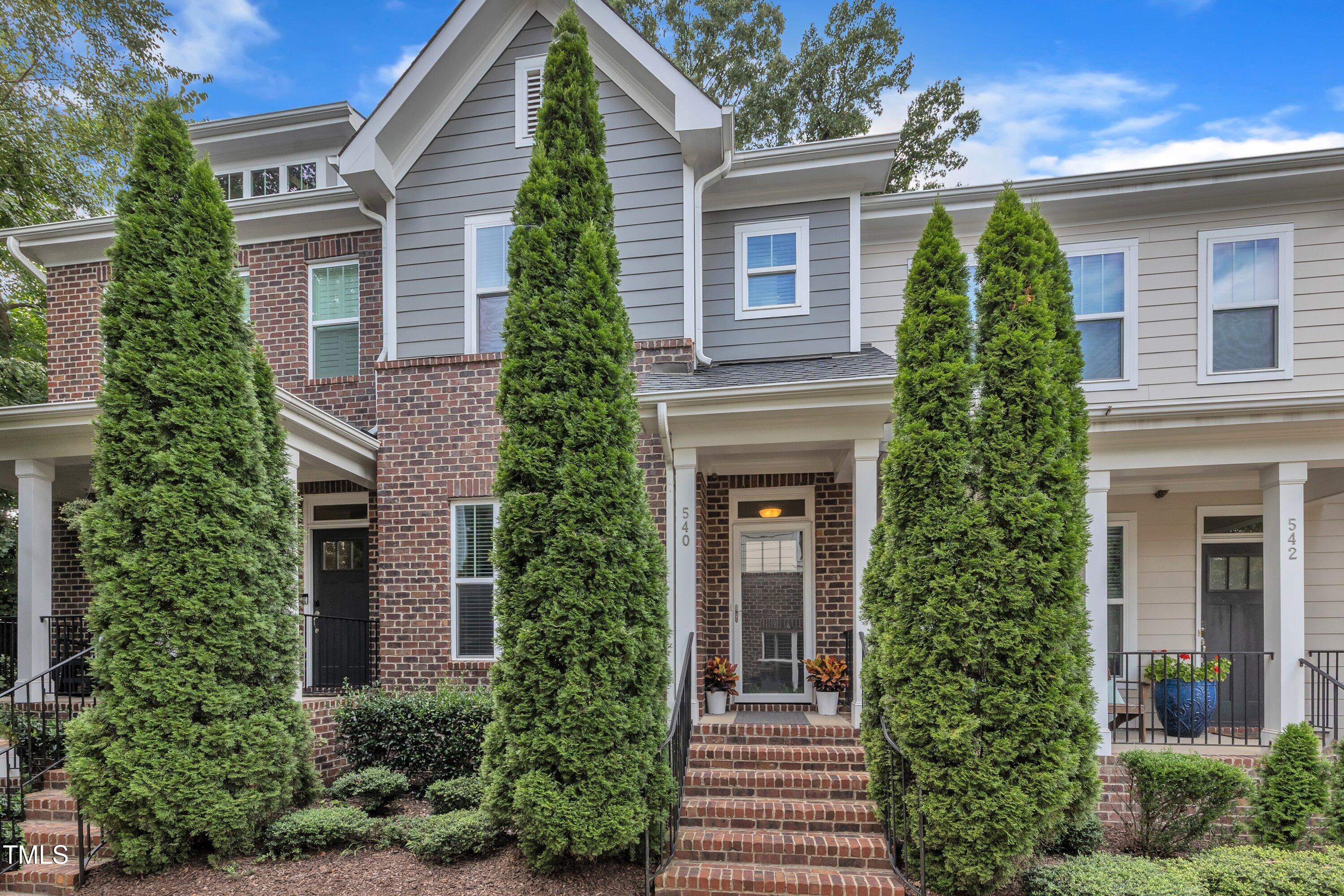 540 Ledbetter Court Raleigh, NC 27608 - Photo 1 of 40 a front view of a house with trees