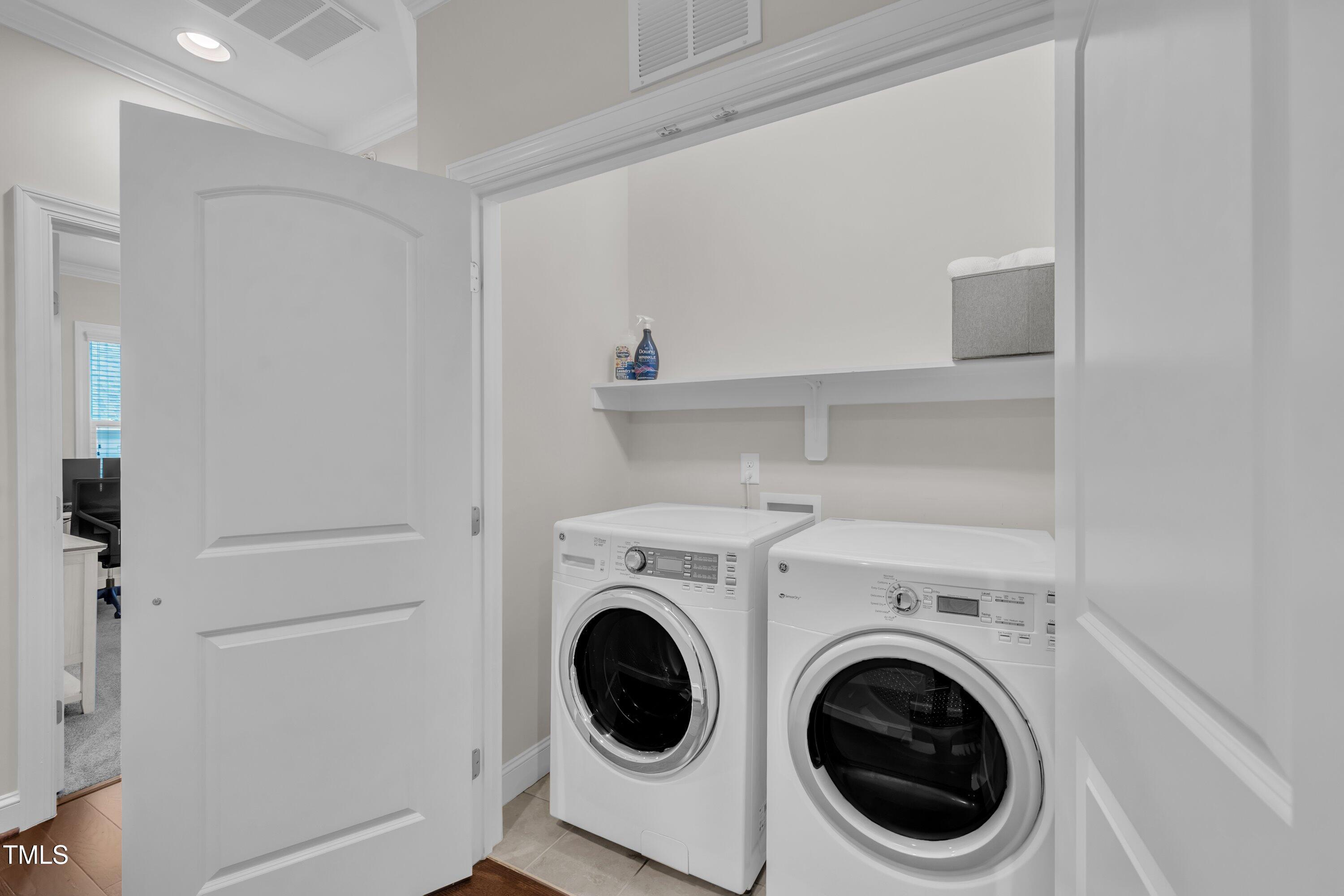 540 Ledbetter Court Raleigh, NC 27608 - Photo 23 of 40 a utility room with dryer and washer