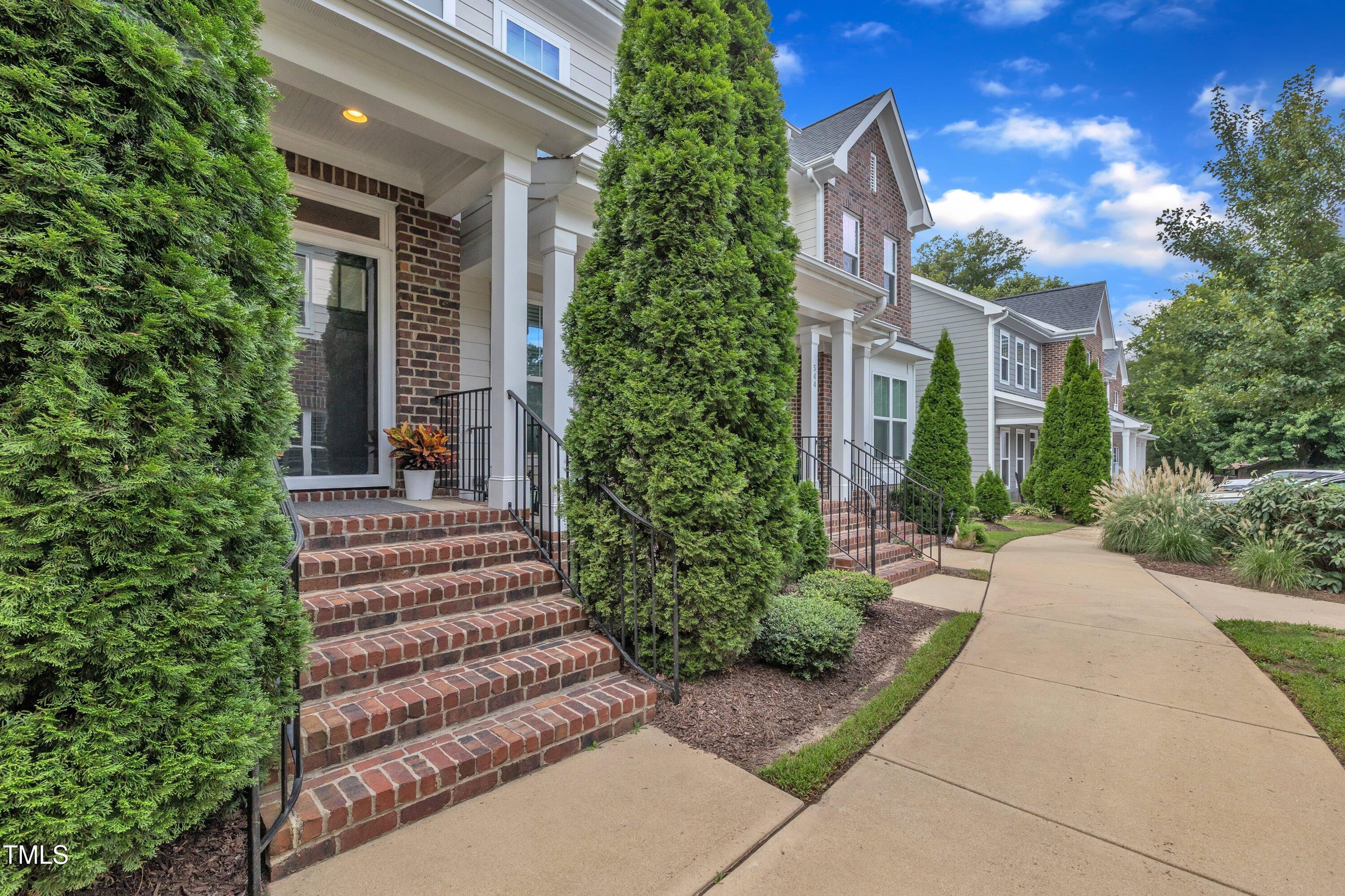 540 Ledbetter Court Raleigh, NC 27608 - Photo 2 of 40 a view of a house with plants and trees
