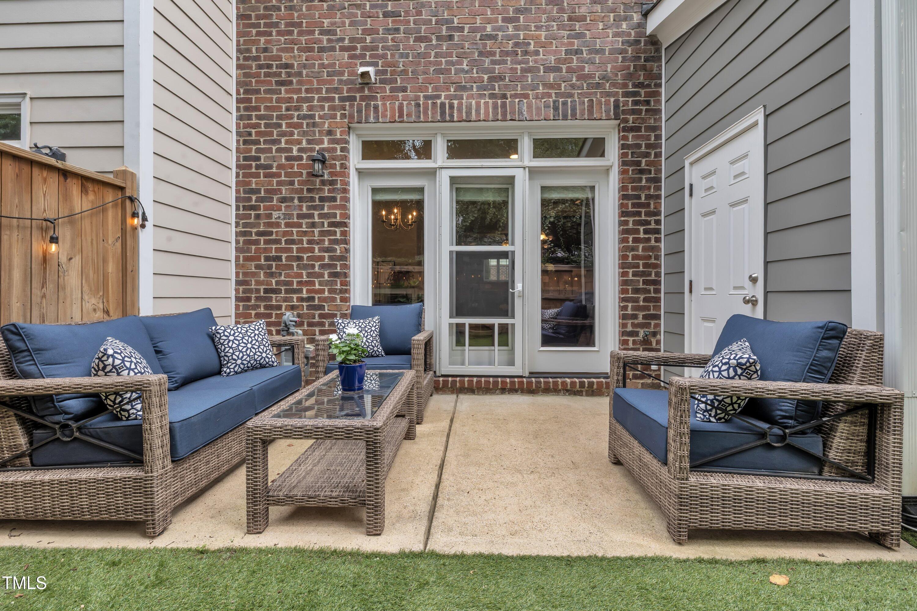 540 Ledbetter Court Raleigh, NC 27608 - Photo 32 of 40 a view of a house with couches chairs and a yard
