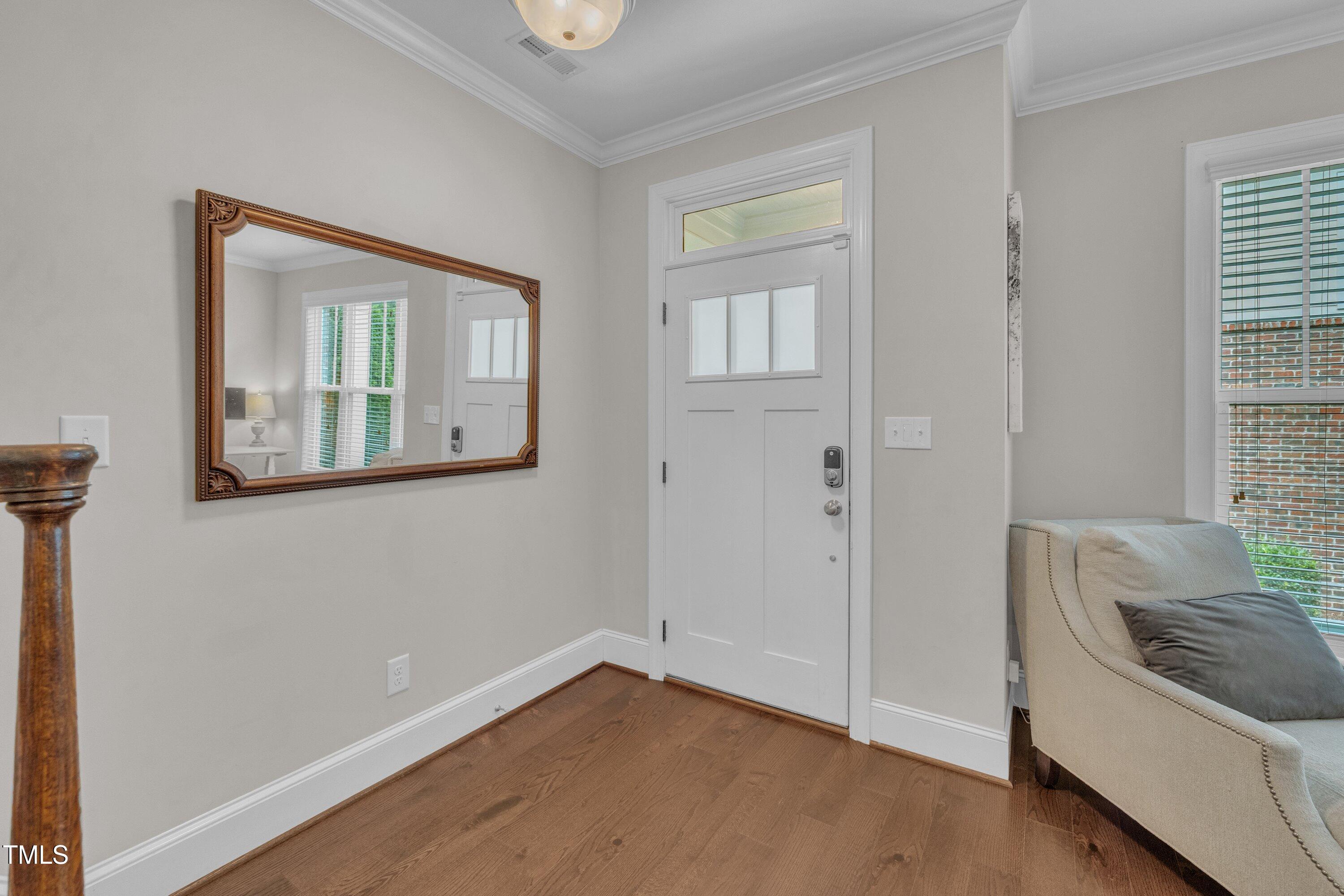 540 Ledbetter Court Raleigh, NC 27608 - Photo 4 of 40 a view of a room that has a sink and a mirror in it
