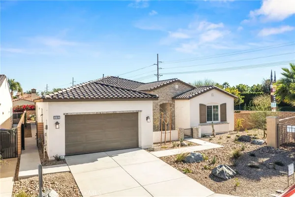 a front view of a house with backyard