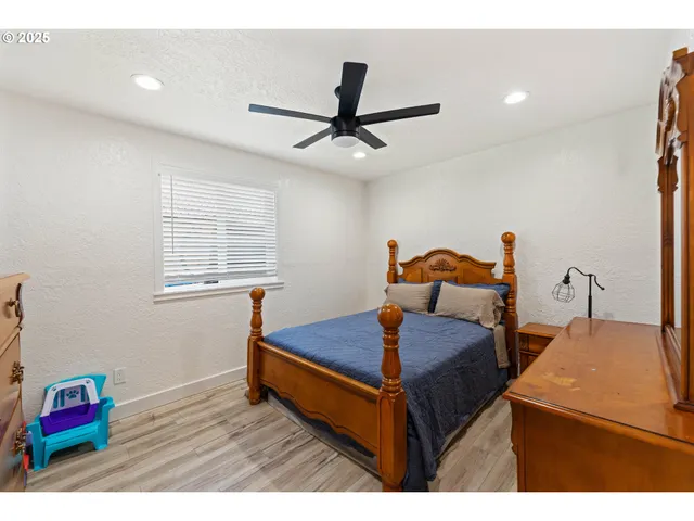 a bed room with a bed and a window