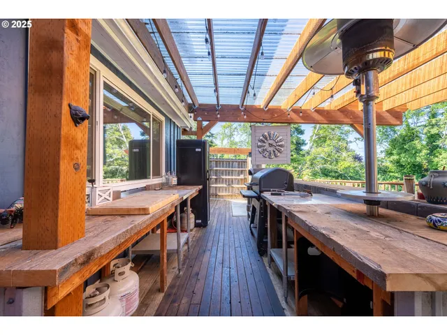 a kitchen view with wooden floor and outdoor seating