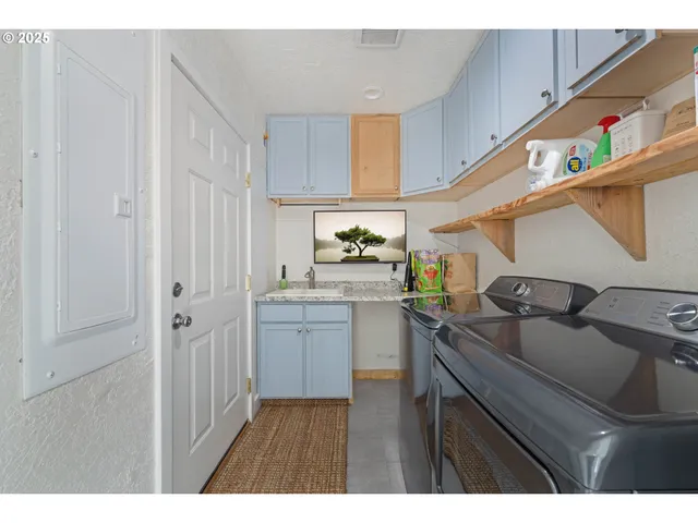 a kitchen with a sink and cabinets