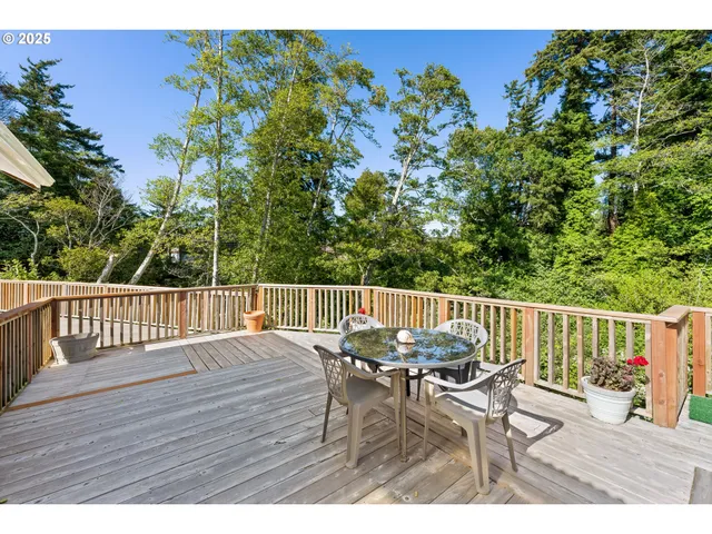 a kitchen view of counter top space a sink a refrigerator and a cabinets
