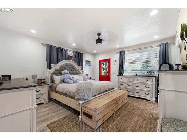 a bedroom with furniture and a window