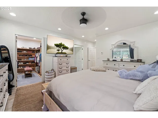 a bedroom with furniture and a bed