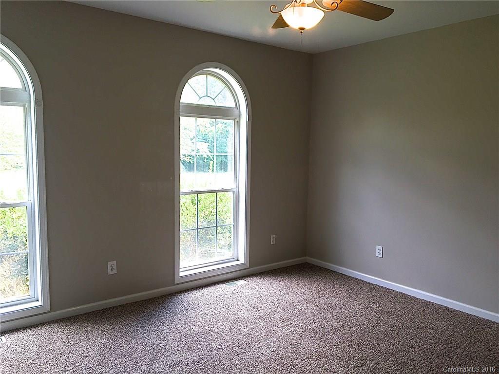 49487 Quail Trail Road Norwood, NC 28128 - Photo 14 of 24 an empty room with a window