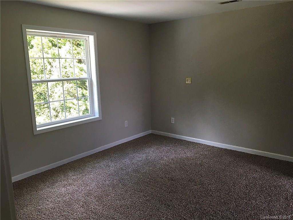 49487 Quail Trail Road Norwood, NC 28128 - Photo 16 of 24 an empty room with a window