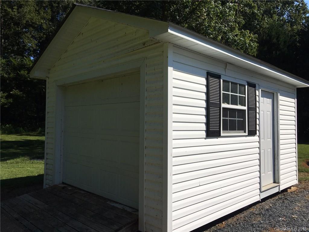 49487 Quail Trail Road Norwood, NC 28128 - Photo 24 of 24 a view of a house with a yard