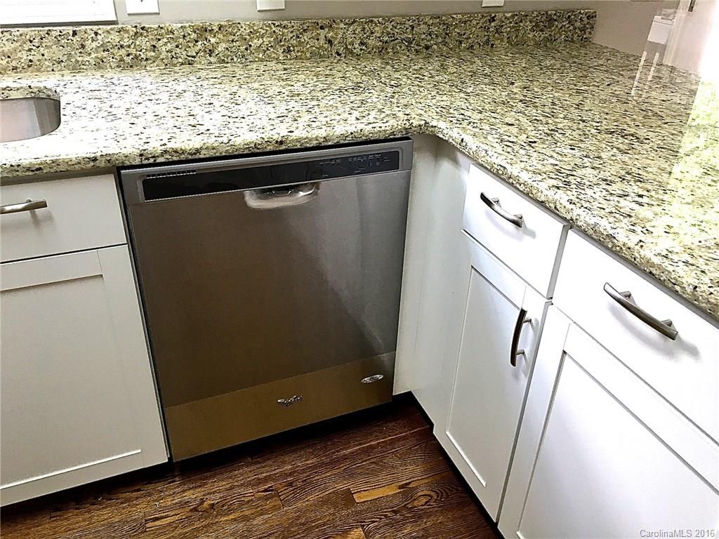 49487 Quail Trail Road Norwood, NC 28128 - Photo 9 of 24 a view of a kitchen with wooden floor