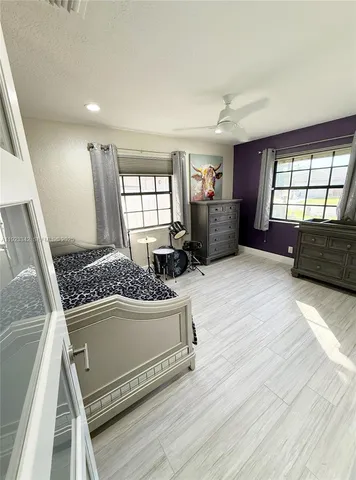 a room with furniture and a flat screen tv