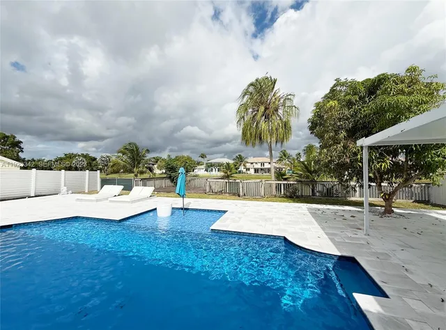a lobby with furniture and floor to ceiling window