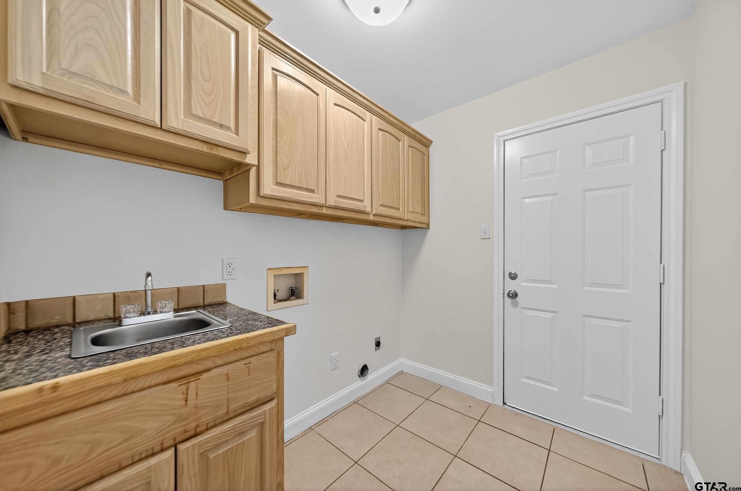 21112 Altuda Lane Flint, TX 75762 - Photo 15 of 48 a kitchen with stainless steel appliances granite countertop a sink and cabinets