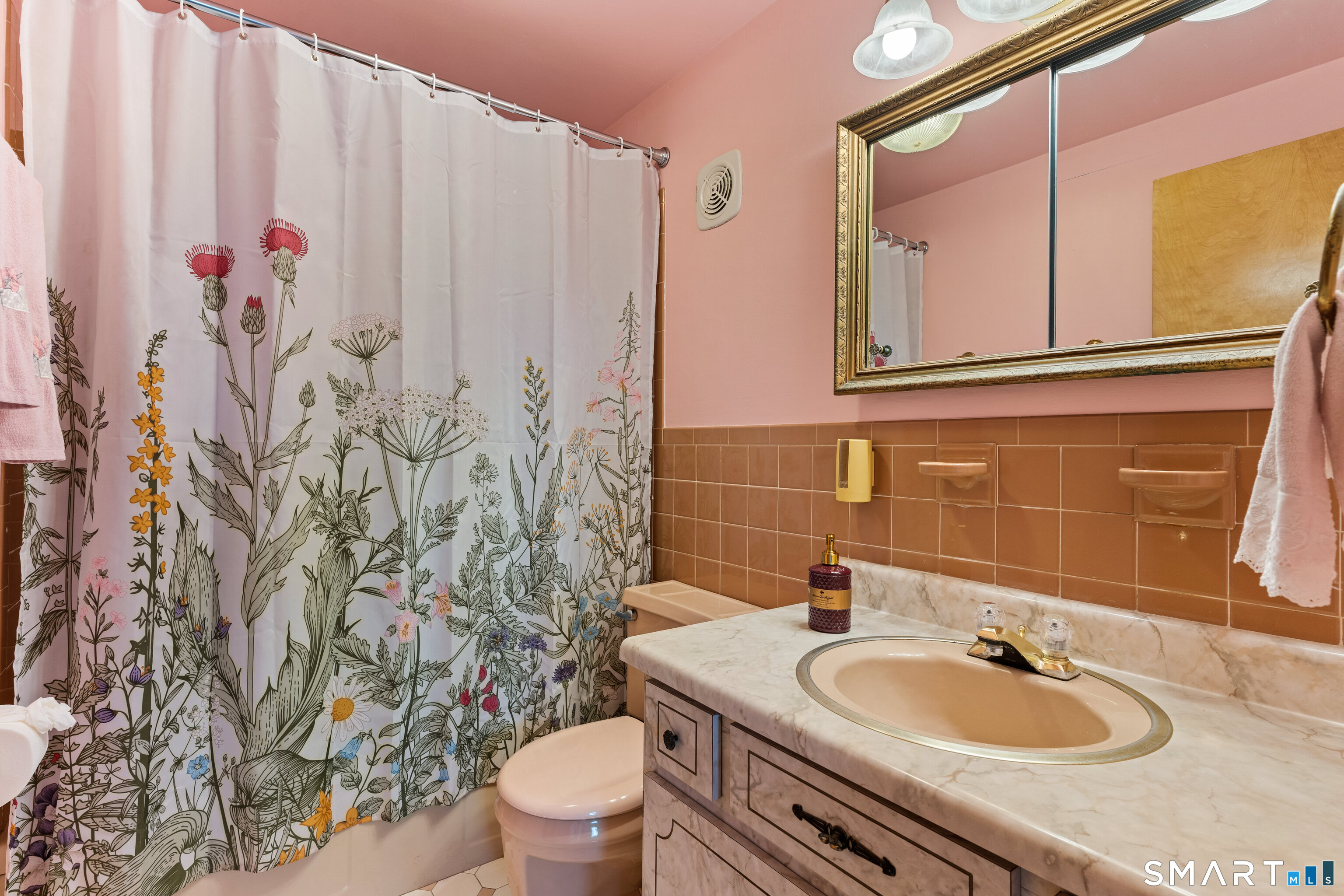 251 Shelter Rock Road Fairfield, CT 06825 - Photo 25 of 38 a bathroom with a granite countertop sink and a mirror