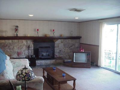 873 Passer Road Coopersburg, PA 18036 - Photo 6 of 8 Family room with the stone fireplace. New vinyl 3 pane slider to pool area.