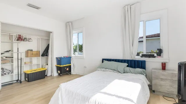 a bathroom with a toilet a sink and a mirror