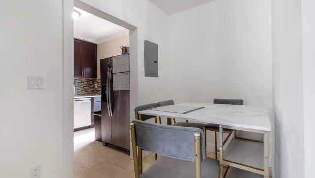 a kitchen with stainless steel appliances granite countertop a stove and a microwave