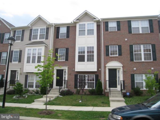840 Lowe Road Middle River, MD 21220 - Photo 1 of 1 a front view of a residential apartment building with a yard