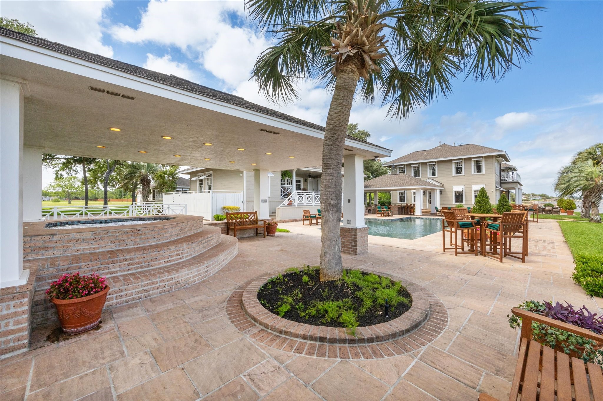 102 South R Street La Porte, TX 77571 - Photo 22 of 43 Plenty of space for dining, relaxing and entertaining around the pool and hot tub.