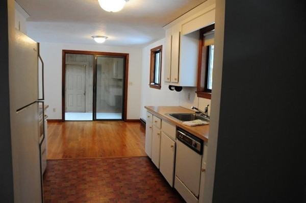 17 Michael Road Bourne, MA 02559 - Photo 5 of 12 a kitchen with a stove and a refrigerator