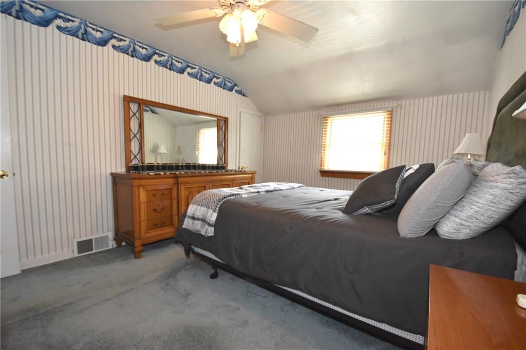 541 Haverhill Road Pittsburgh, PA 15228 - Photo 11 of 28 a bedroom with a bed and a chandelier