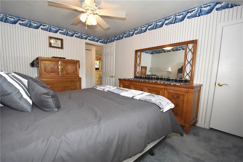 541 Haverhill Road Pittsburgh, PA 15228 - Photo 12 of 28 a bedroom with a bed and a chandelier
