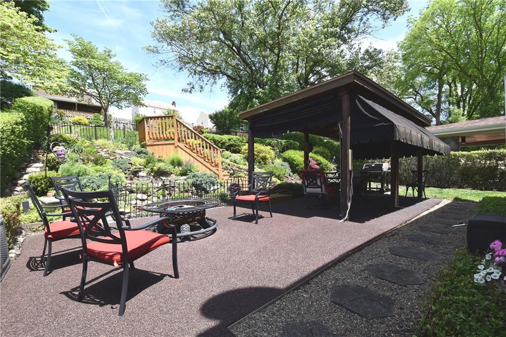 541 Haverhill Road Pittsburgh, PA 15228 - Photo 21 of 28 a view of patio with a table and chairs under an umbrella