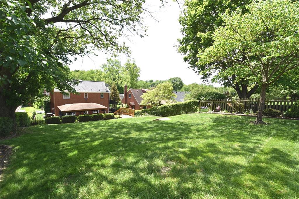 541 Haverhill Road Pittsburgh, PA 15228 - Photo 23 of 28 a backyard of a house with lots of green space and fountain