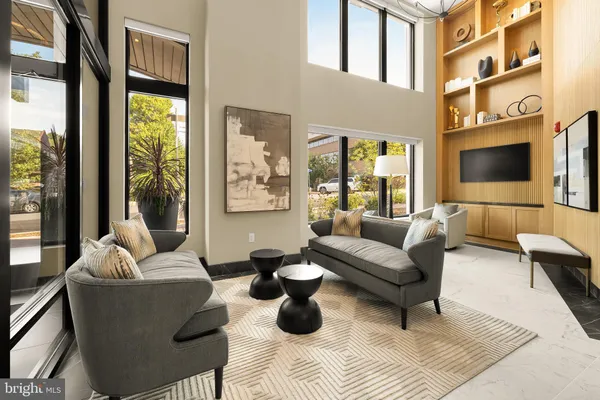 a view of a building with sitting area and furniture