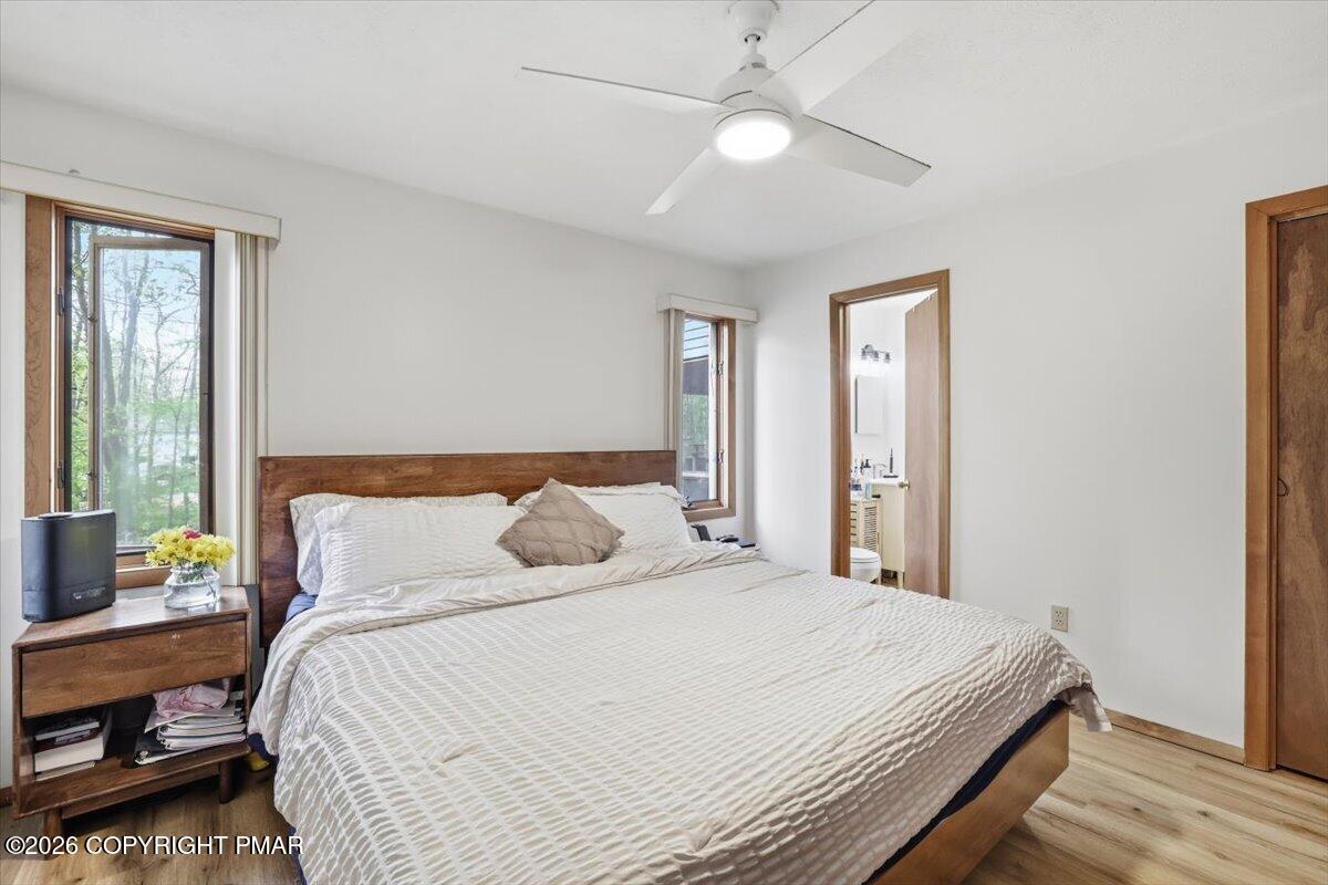 126 Dunchurch Drive Bushkill, PA 18324 - Photo 17 of 34 a bedroom with a bed and a chandelier