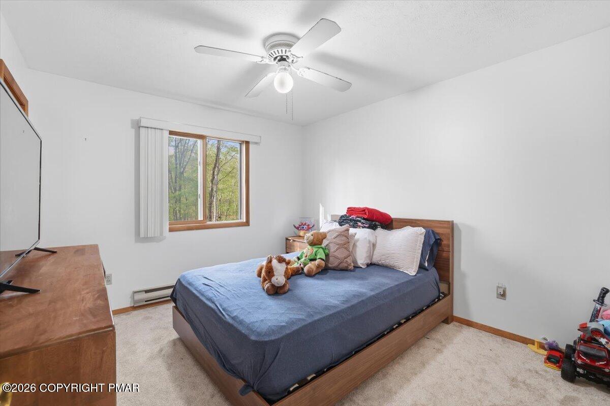126 Dunchurch Drive Bushkill, PA 18324 - Photo 27 of 34 a living room with furniture and a chandelier
