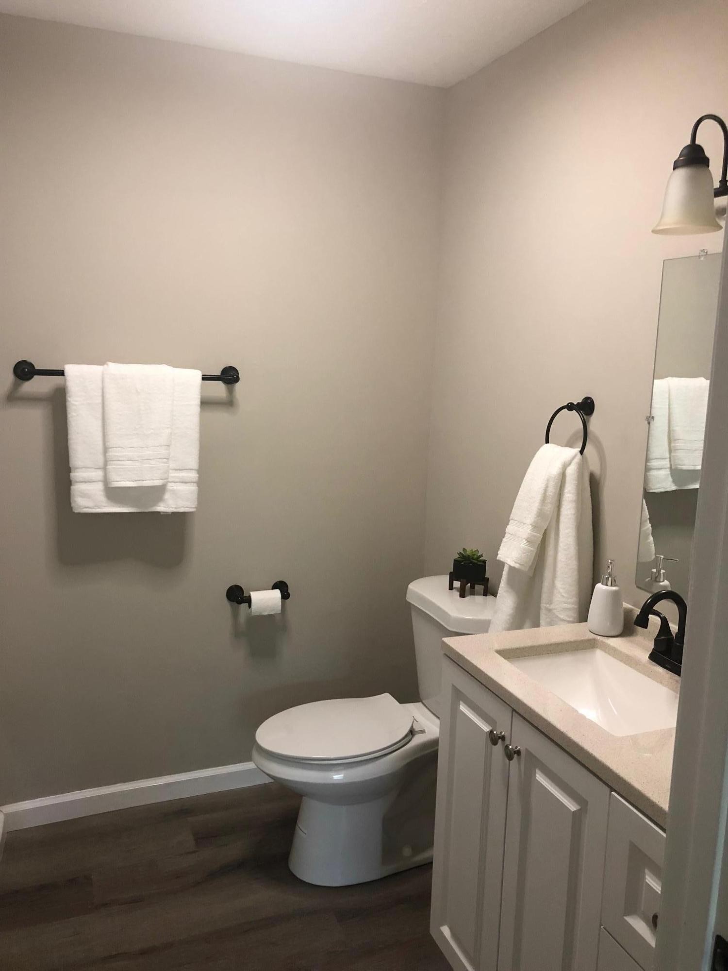 114 Oak Road Powell, TN 37849 - Photo 5 of 12 a white toilet sitting next to a bathroom sink