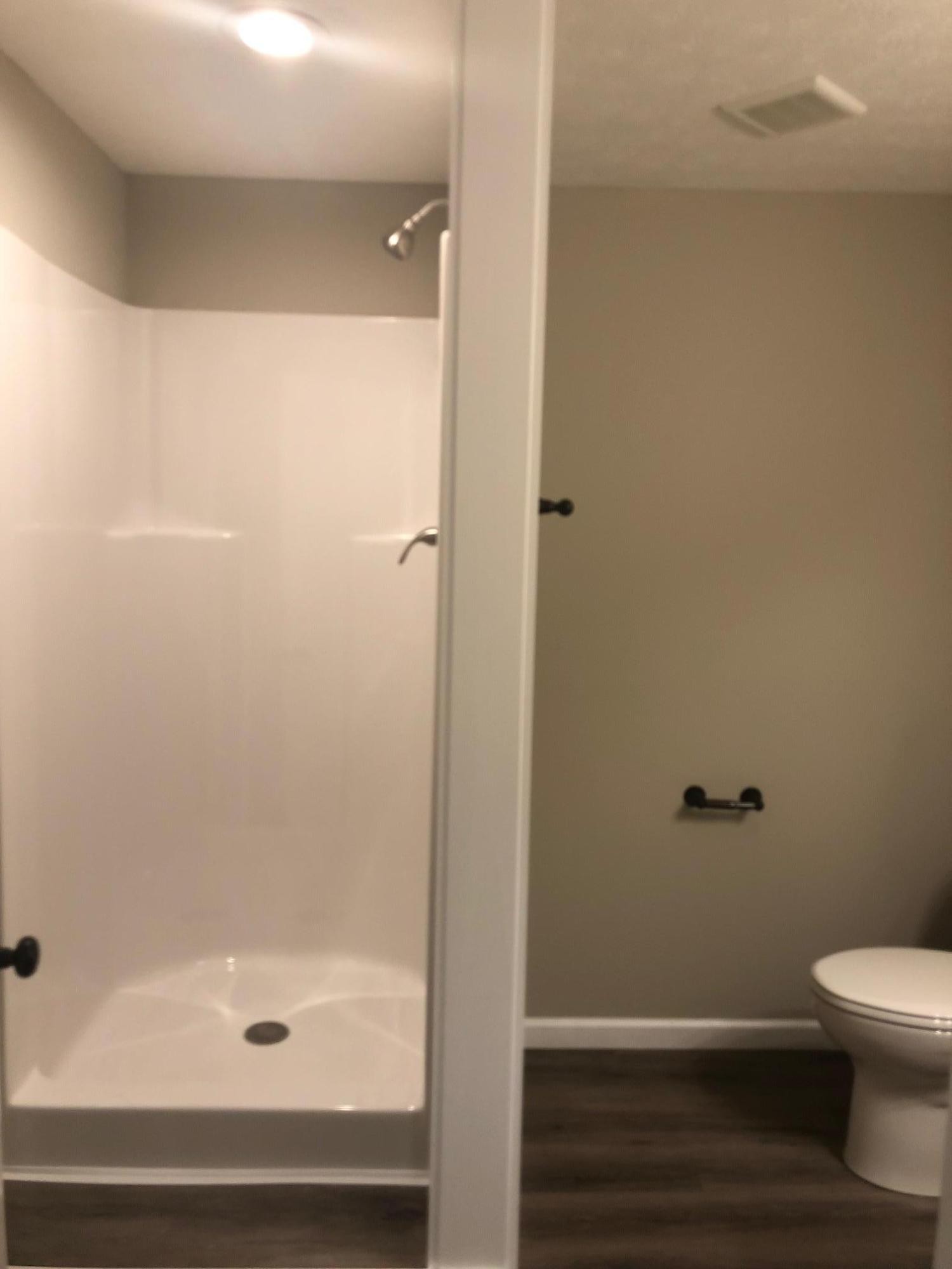 114 Oak Road Powell, TN 37849 - Photo 6 of 12 a bathroom with a shower and toilet