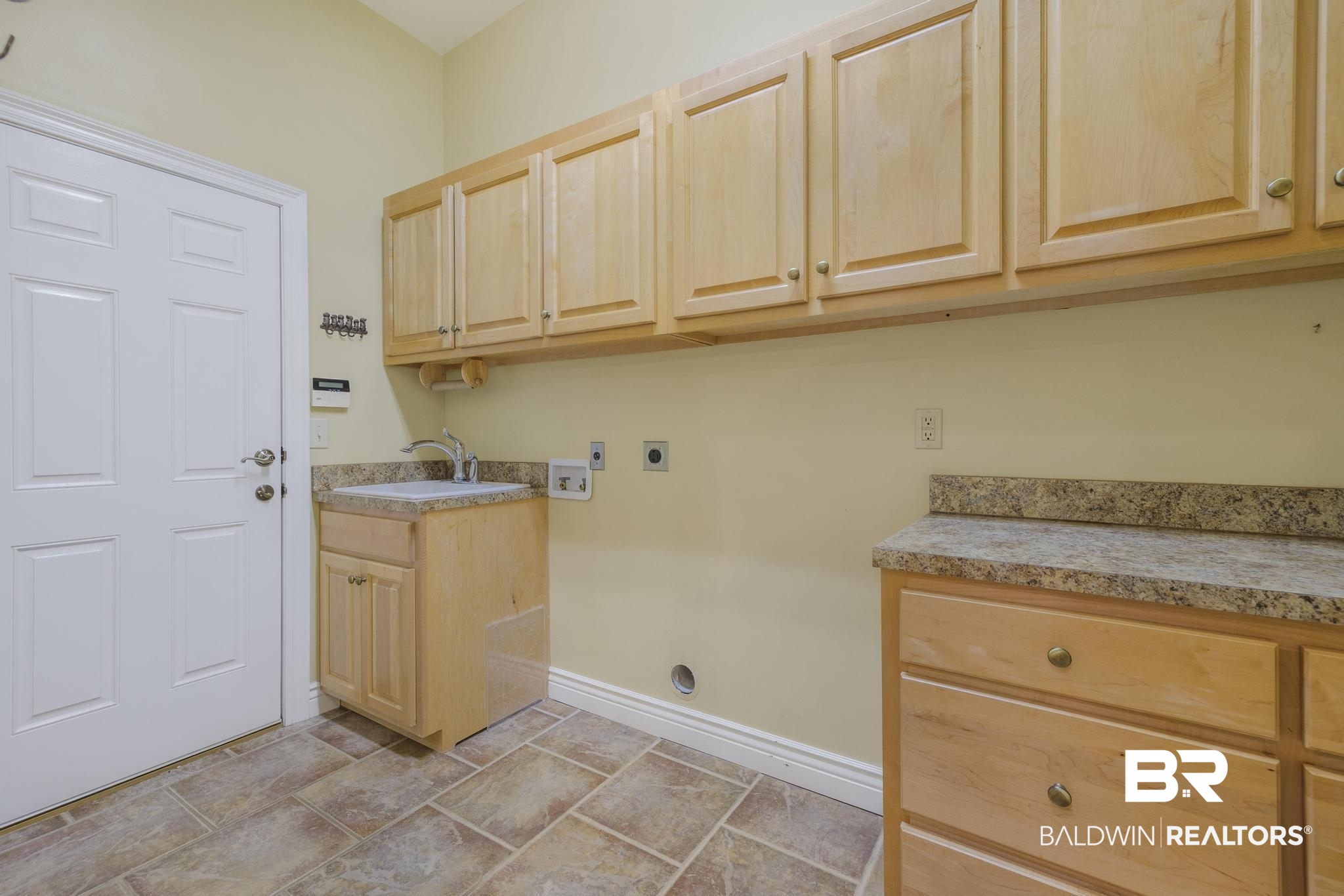 13612 Rue Royal Lane Silverhill, AL 36576 - Photo 41 of 65 Laundry area with electric dryer hookup, cabinet space, and washer hookup