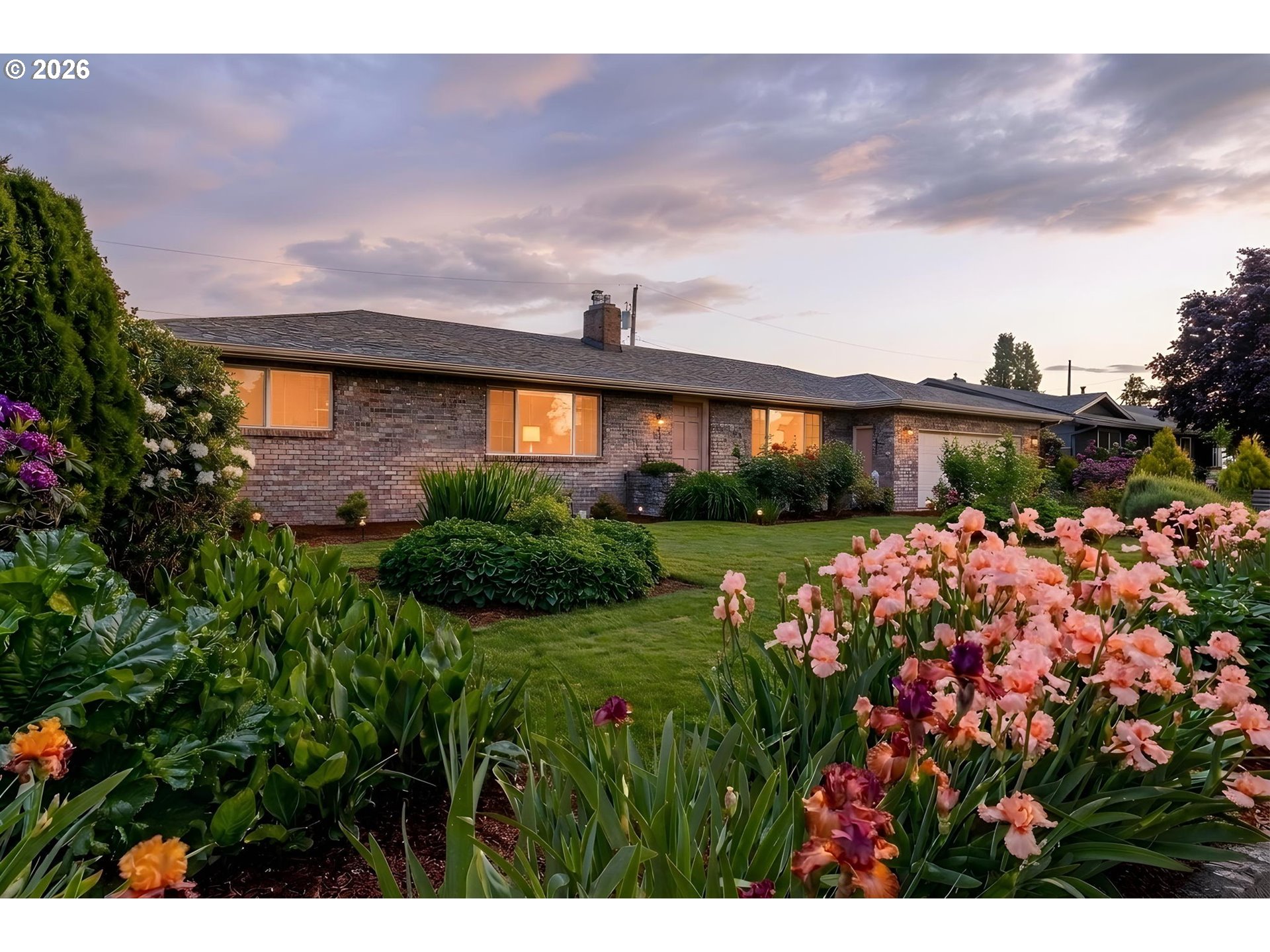 2465 17th Street Springfield, OR 97477 - Photo 3 of 47 a front view of a house with a yard and potted plants