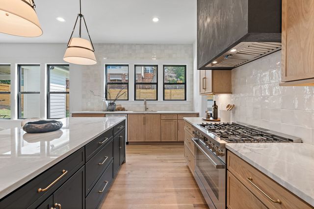 a kitchen with a sink and a refrigerator