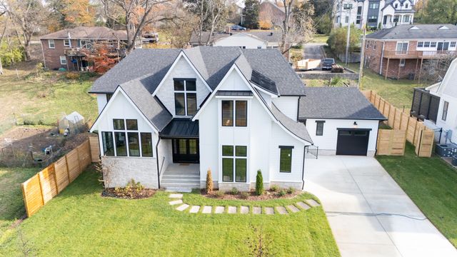 a living room with furniture fireplace and a large window