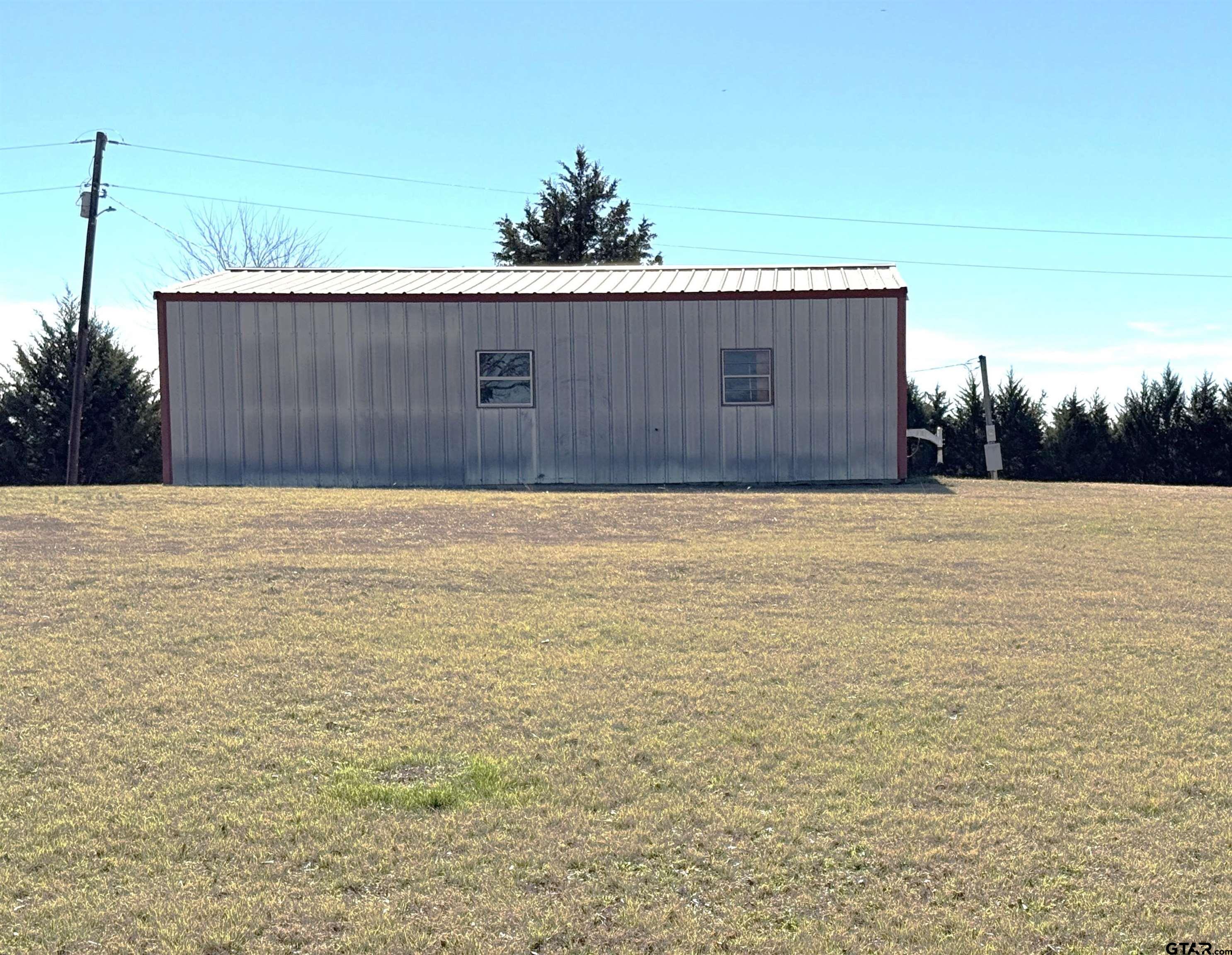 18445 Farm To Market 137 Roxton, TX 75477 - Photo 4 of 7 a view of a backyard