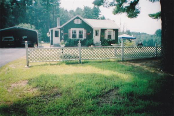 44 Turnpike Road Townsend, MA 01469 - Photo 11 of 13 a front view of a house with a garden