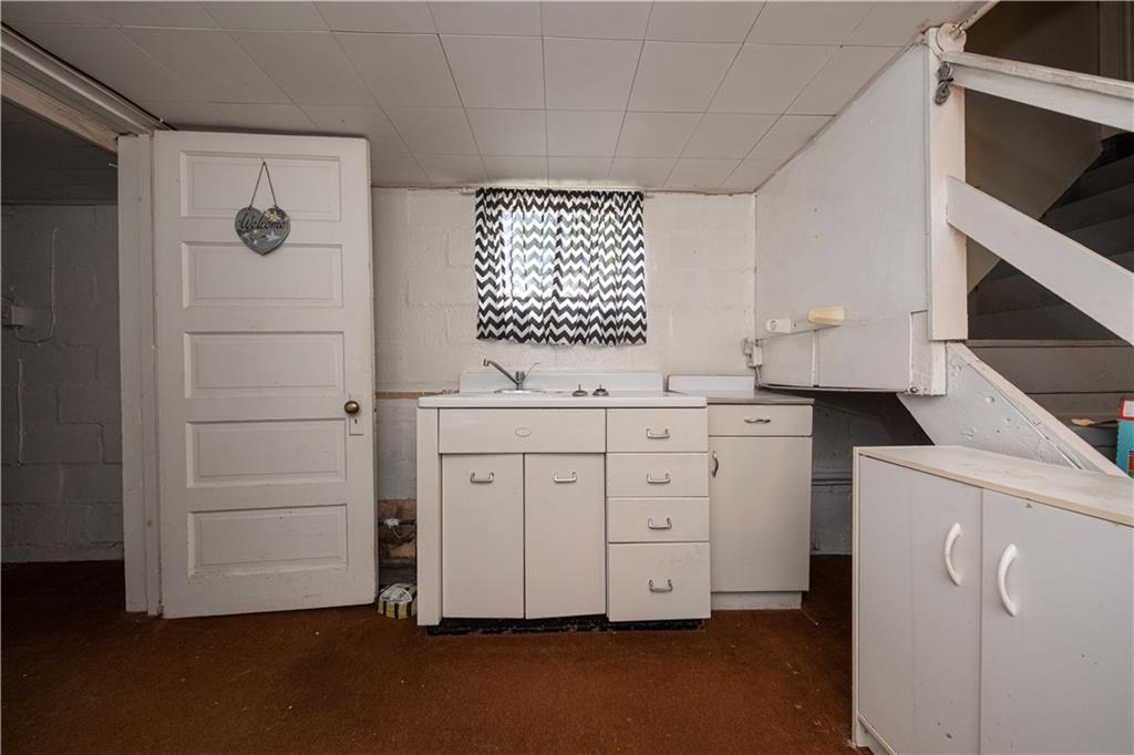 44 Forest Grove Road Coraopolis, PA 15108 - Photo 17 of 29 a room with a white cabinets and sink