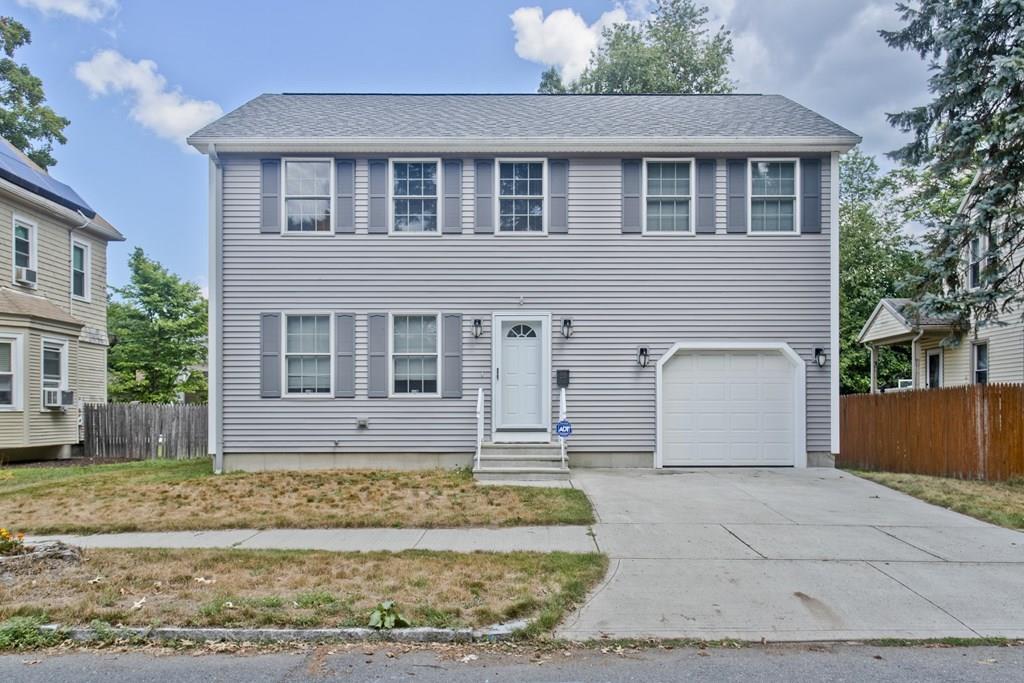 39 Spencer Street Springfield, MA 01118 - Photo 1 of 30 a front view of a house with a yard